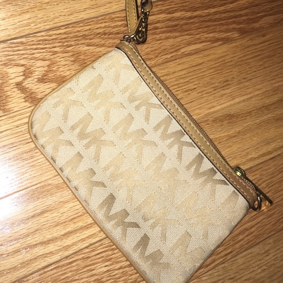 Michael Kors Handbags - Soft brown Michael Kors wristlet